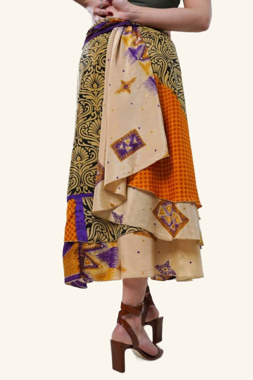 Backside of long wrap skirt with bold leaf motif on model