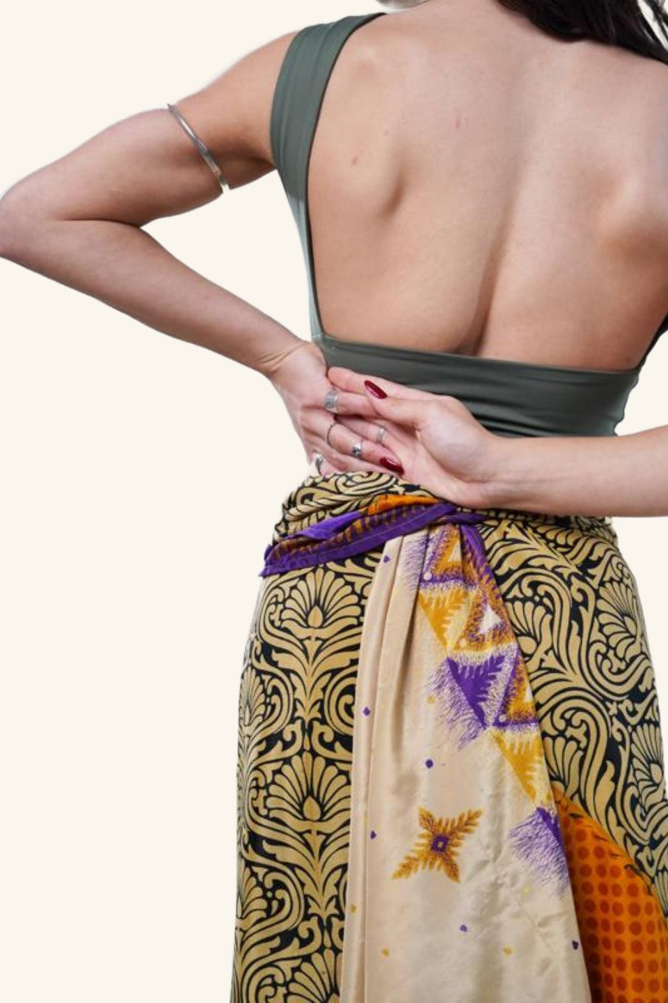long wrap skirt with bold leaf motif on model detail picture