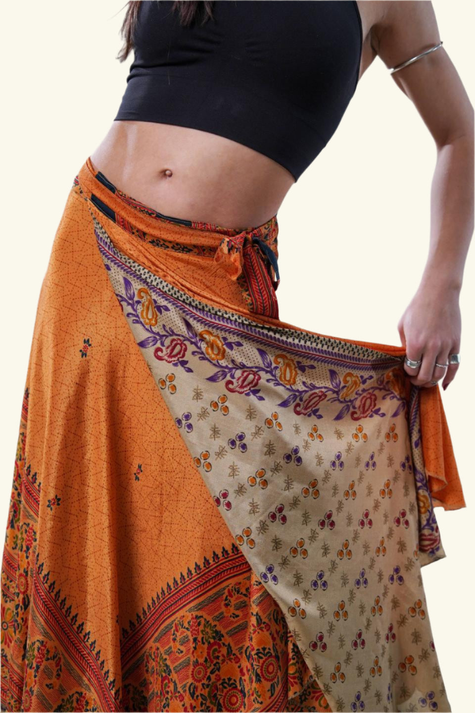 Long wrap skirt with orange paisley design on model