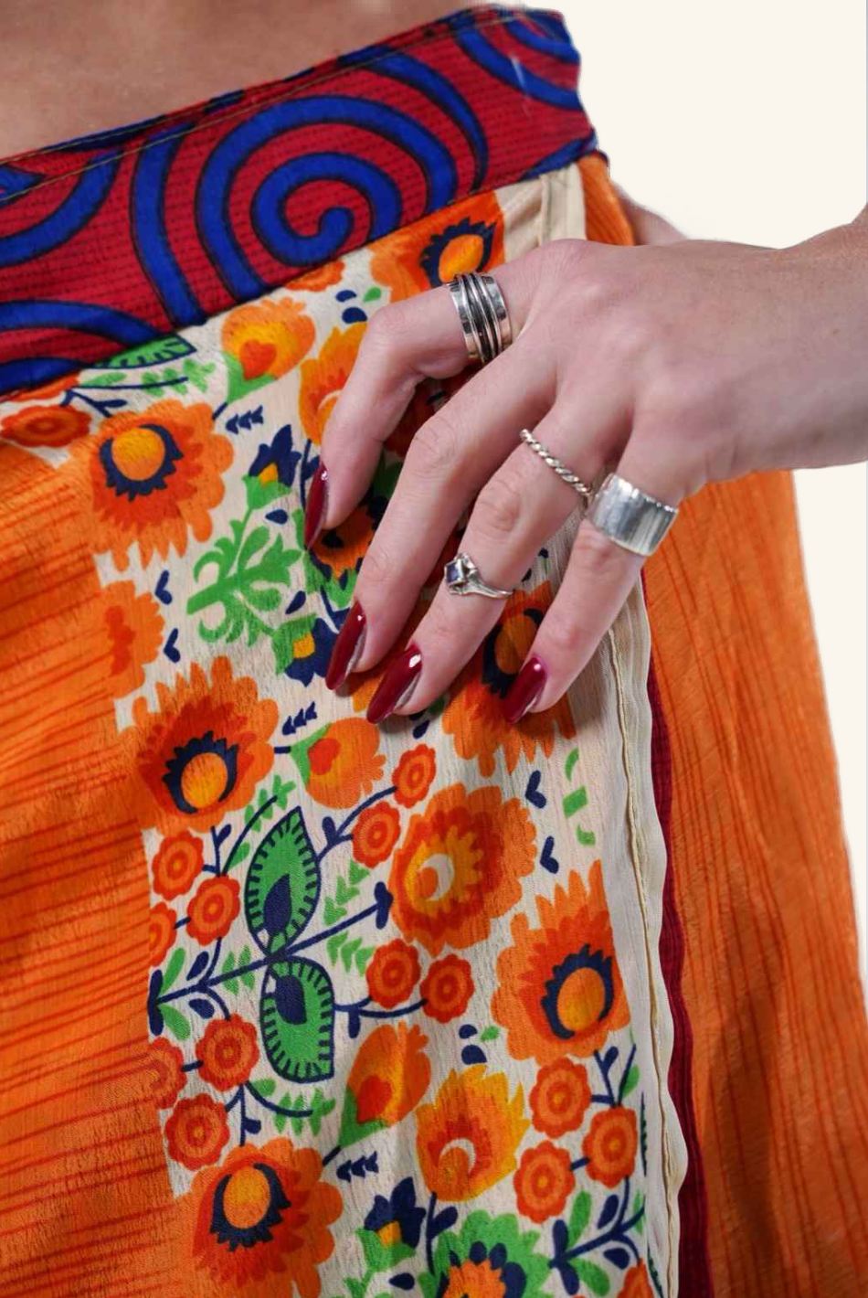 Short wrap skirt with orange floral design detail picture