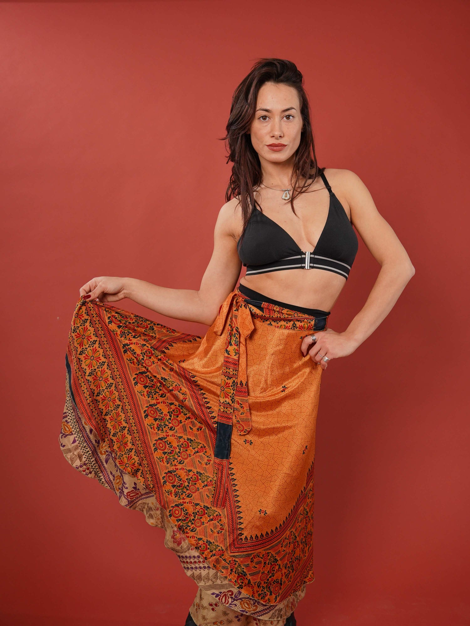 Woman holding up her wrap skirt