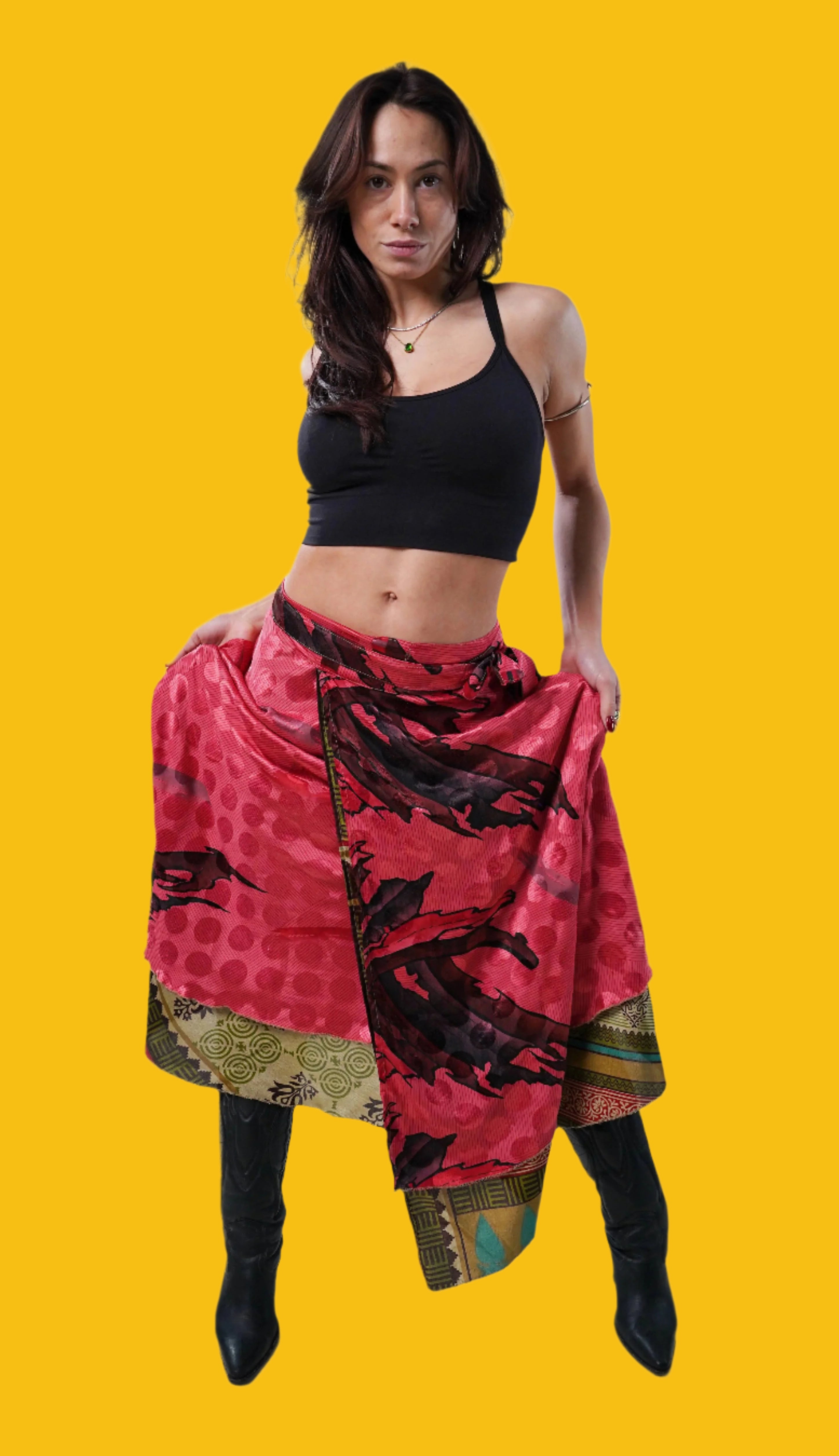 Model wearing FREEYA wrap skirt made from vintage saris, relaxed pose in studio setting