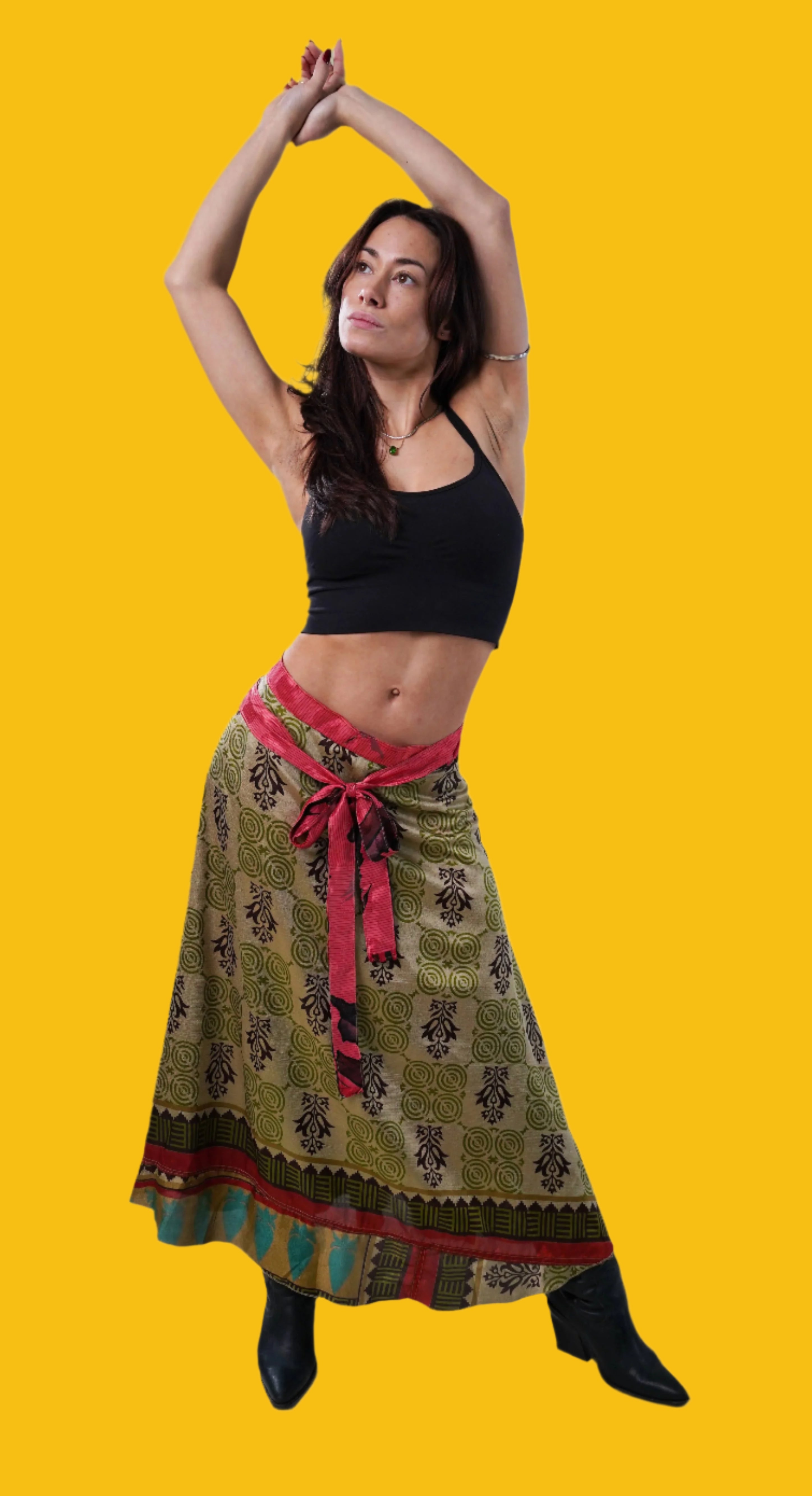 Long FREEYA wrap skirt made from vintage saris, worn in studio, green with black and pink accents
