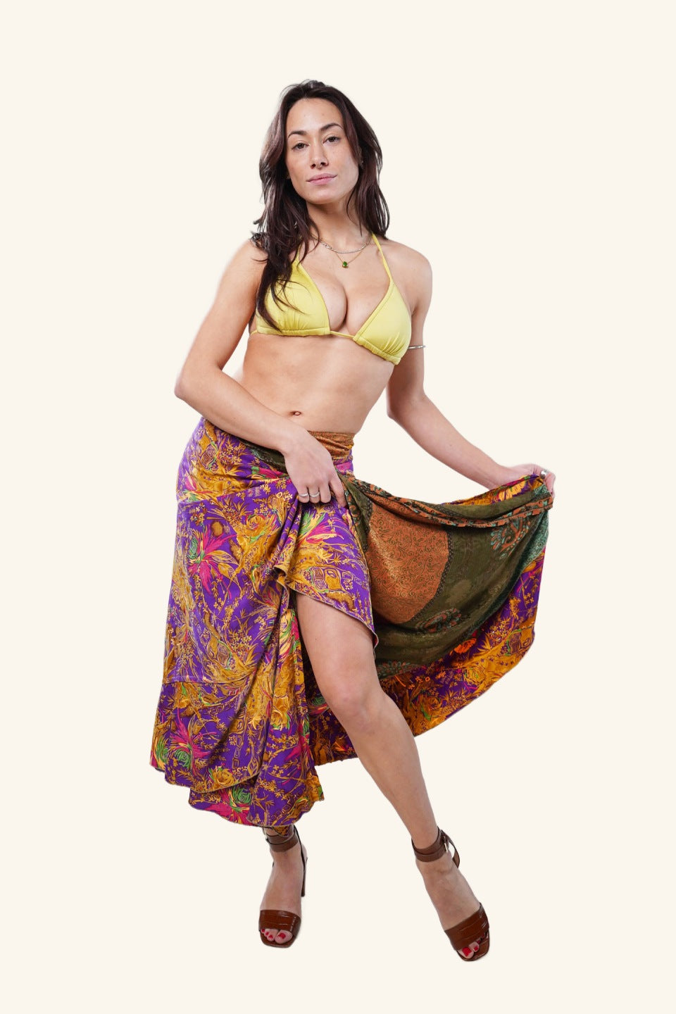 Model showing long wrap skirt with floral design