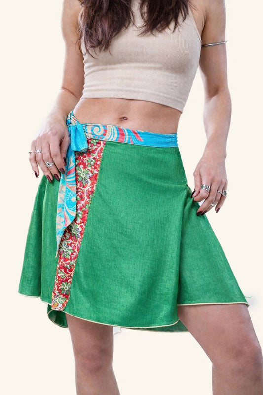 Green skirt with a colorful tie on a white background