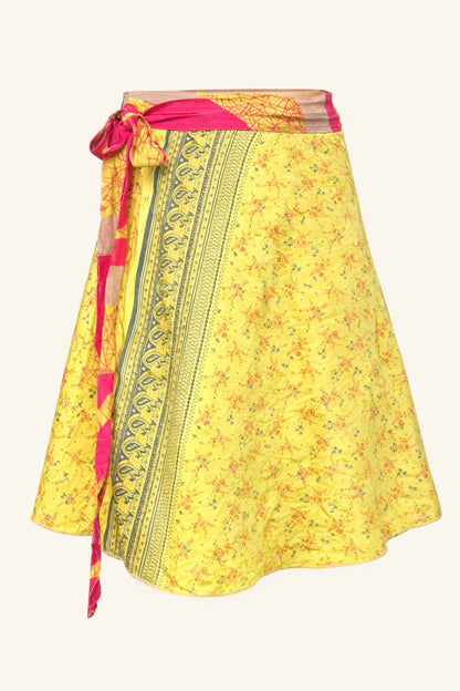 Yellow floral skirt with a patterned tie on a white background